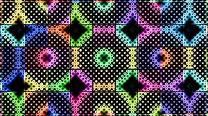 Colorful geometric patterns dance in sync under vibrant lighting at night