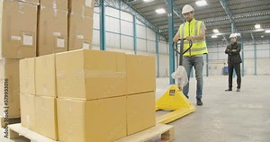 warehouseman wearing high visibility vest and hard hat show his manager in suite perform stock check trolley inspection quantity and quality raw material keep in storage room before production