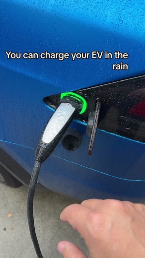Yes you can charge your Tesla in the rain #tesla #tsla #charging #fyp #viral #rain