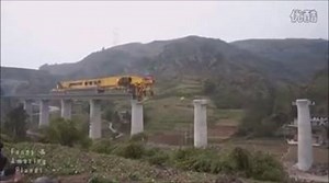 This is the SLJ900/32 Bridge Girder Erection Machine working away in China. It's a substitute for large, immobile cranes that take up large amounts of space on a construction site. It's also pretty amazing engineering feat. | Samistream.tv