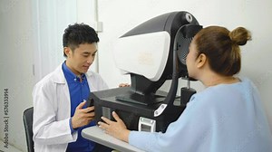 Asian optician doctor working with eye vision measurement machine, Eye exam for senior woman at optical store, diagnostic ophthalmology, Ophthalmologist controlling eye vision measurement machine