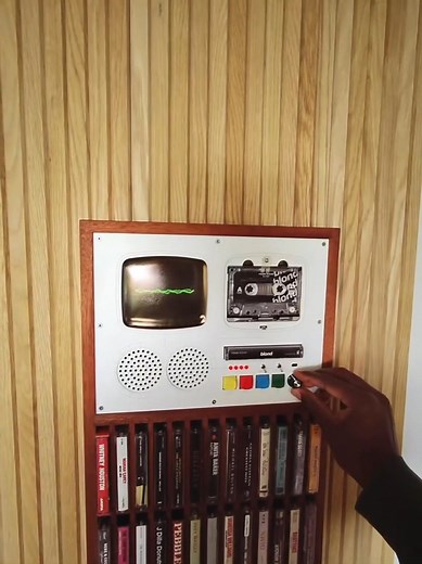 Spin tapes in retro-futuristic style! 🌟 This all-in-one jukebox features: • Built-in storage for colorful cassettes 🗃️ • Real-time waveform display & dual speakers 📊 • 1960s sci-fi design with wooden cabinet 🚀 #RetroTech #CassettePlayer #VinylVibes | Tyrell Wiker Kay