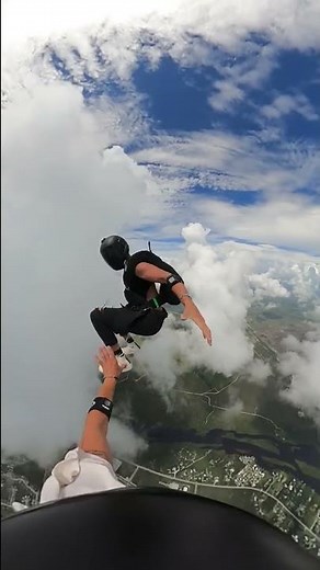 Skydiver Gives Handshake to Buddy During Free Fall - 1354079
