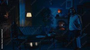 Zoom in video capturing two ghost hunters entering a dark room in search for paranormal activity, navigating in space using flashlights.