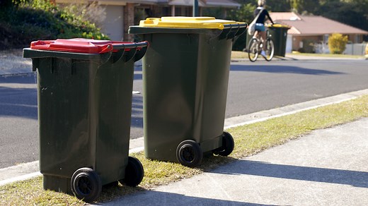 This Trash Can Hack Makes Moving Two Bins At Once A Snap - House Digest