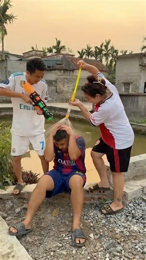 Messi had water poured on him by his friends.