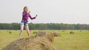 Happy Girl Dancing On Haystack Harvesting Stock Footage Video (100% Royalty-free) 1036007840 | Shutterstock