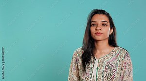 Authoritative woman doing shushing hand gesturing, demanding secrecy, irritated by noise. Stern person complaining, placing finger on lips, doing quiet warning sign gesture, studio background, camera Stock Video