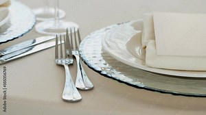 Cutlery and a plate on a served table. Table setting. Preparing the restaurant for the opening. Decorated for a dinner