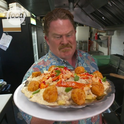#CaseyWebb tries his hand at the Nova Scotia challenge! Fries smothered in clam chowder, topped with lobster and fried scallops! Does he have what it takes? 👀 #ManVFood | Food Network UK
