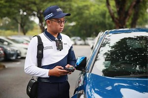 New common hotline launched for parking offences; parking wardens get new uniform