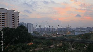 Singapore Construction Cranes and Traffic Light Trails at Sunset