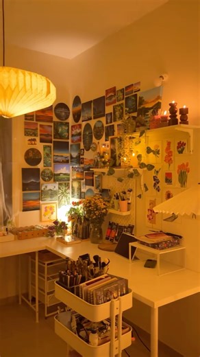 Pankhuri | Acrylic and Gouache Landscape Artist on Instagram: "Art studio update✨ A peek into my new studio, filled with warmth and 46974227 lamps🏮 Finally moved into a new flat and created my art studio from scratch! It was very hard to let go of my old studio, but I tried to keep its vibe alive here in the new studio. It took some time to settle in and organize my stuff, but the wait made me even more excited to decorate and make this space feel like home 🎀 Can’t wait to get back to painting