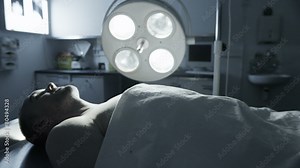 Dead male body laid out on an autopsy table