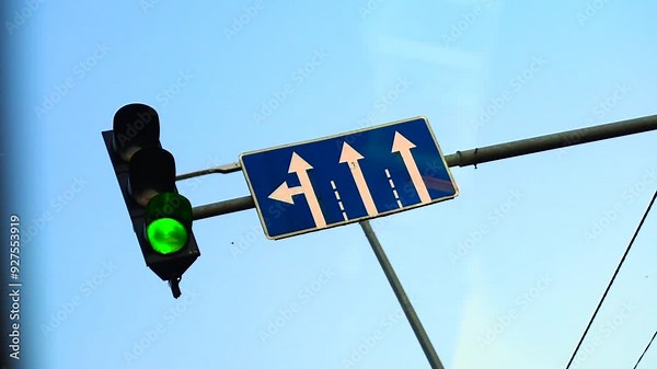 The traffic light changes from red to green. Road rules. City traffic. Traffic rules