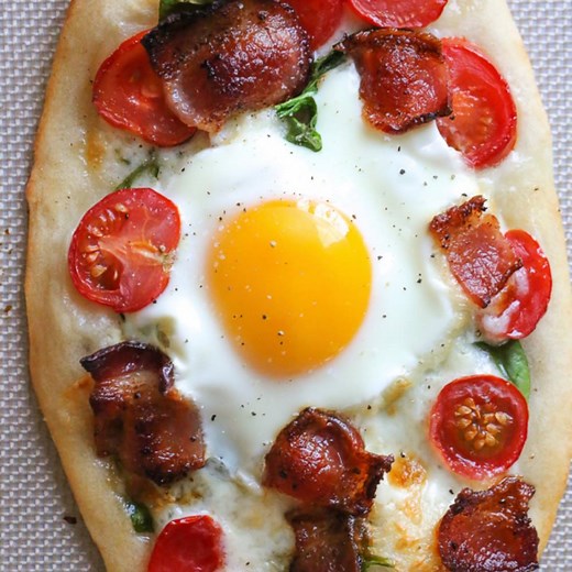 This easy, homemade BREAKFAST PIZZA is made compeletly from scratch with the bagel dough topped with bacon, eggs, tomatoes, spinach and cheese. Ready in less than 30 minutes start to finish! 5 Freestyle Points • 271 Calories https://www.skinnytaste.com/breakfast-pizza/ | Skinnytaste
