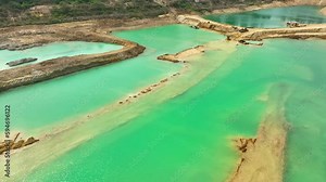 Sand quarries from aerial view, Some quarries are long and narrow, while others may be wider and more circular. The depth of the pit may also vary, ranging from a few meters to several dozen meters. Stock Video