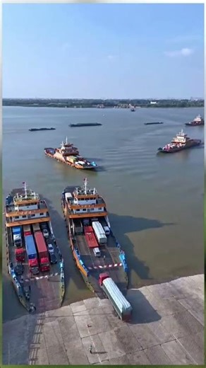 Why not build a bridge? Hundreds of trucks and cars take turns boarding and exiting ferries every...