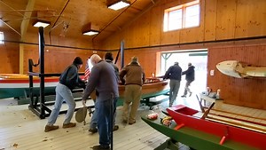 The countdown to opening day for the 2023 season has begun! With 44 days to go until we open on May 6th, our winter Boat Shop volunteer crew is giving Curator/Collections Manager Matt Macvittie and Master Boatwright Michael Gorman a hand moving boats and engines as the installation of two new exhibits begins. | Antique Boat Museum