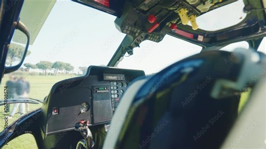Control panel with different command buttons and joysticks for navigation of helicopter cockpit, interior view of aircraft with necessary indicators for flight, helicopter commands and aviation