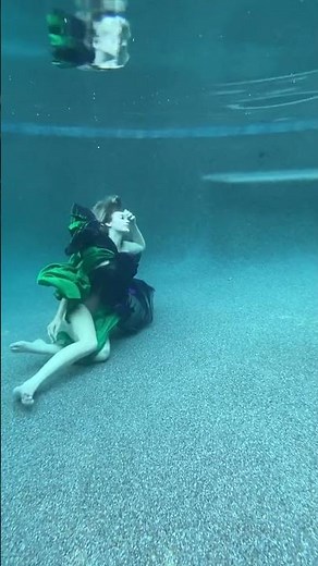 Mesmerizing underwater photoshoot: a model's grace in flowing fabric