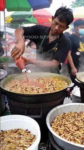 The deliciousness of sago worms with a bottle of tomato sauce@muhibbudinfood-ai