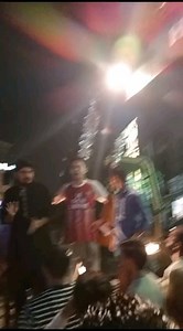 Ali Abdullah Khan, spokesperson PSC is addressing to the students protesting the Punjab government's demolition of Pashtun-owned hotels in Lahore’s Muslim Town, standing atop the crane brought to carry out the destruction. | Progressive Students Collective
