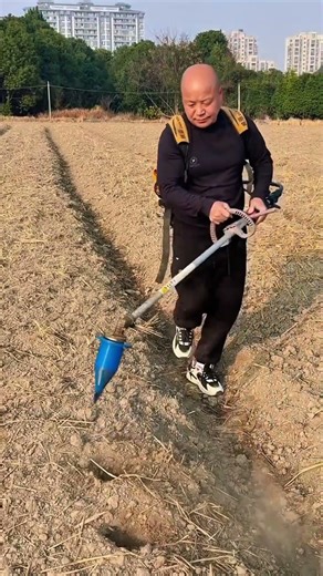 digging garden soil with professional tools for a smooth and very durable planting surface project