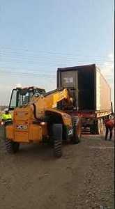 JCB 530-110 Telehandler - Unloading of Solar Panel Boxes from ISO Container