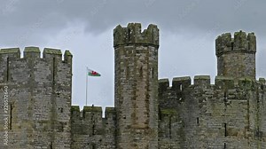 The towers of Caernarfon Castle in the rain , often anglicized as Carnarvon Castle, is a medieval fortress in Caernarfon, Gwynedd, north-west Wales