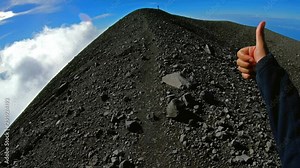 Climbing the crater of Semeru. Backpacker walking around Semeru crater on the top of mountain. POV shot veiw on breathtaking panorama from a height of 3,600 meters