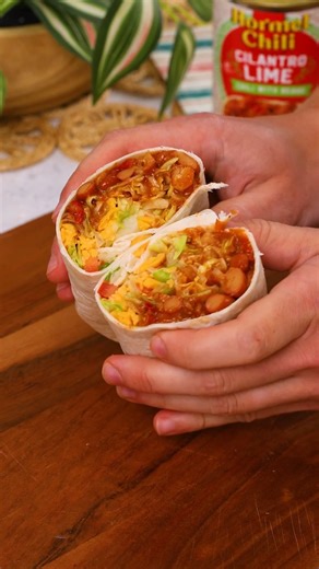 Opening up a can of HORMEL® Cilantro Lime Chili with beans on burrito night is like pulling a "move ahead four spaces" card on game night! Chili burritos are a fast and tasty weeknight meal. | Hormel Chili