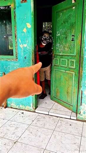 Masked Ghost Playing with Door