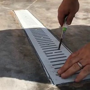 These Watts Dead Level drains are so heavy duty and clean. The single screw holding down each grate screws into a heavy poly frame so even after years of use (which I have multiple clients who have had them for a 3-4 years) the screw easily threads in and out. I’ve used other trough drains that have screws holding the grates along the perimeter and they have always stripped or filled with dirt and become useless/inoperable. These drains are very well designed and made from great materials in my
