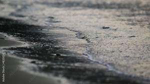 waves lapping on the sand