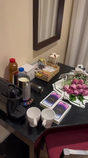 Charming Hotel Room Table Setup with Coffee and Roses