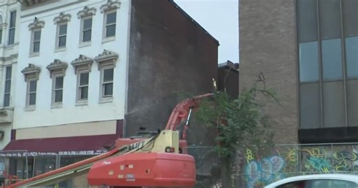 Cause of partial downtown building collapse unclear as city officials wait for inspection