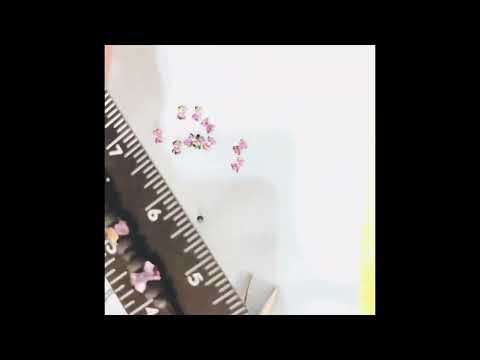 How to thread small beads through thick stretch ￼cords￼