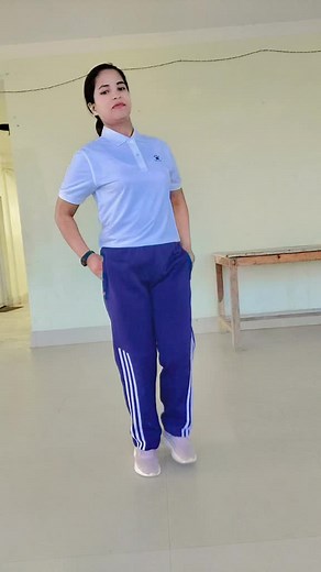 Indoor Exercise Routine with Arm Movements and Leg Lifts