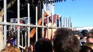 Video: Girl wedgies herself while trying to hop the fence at a festival