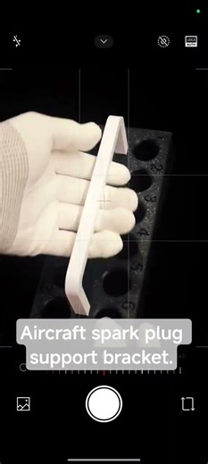 Aircraft spark plug support bracket.