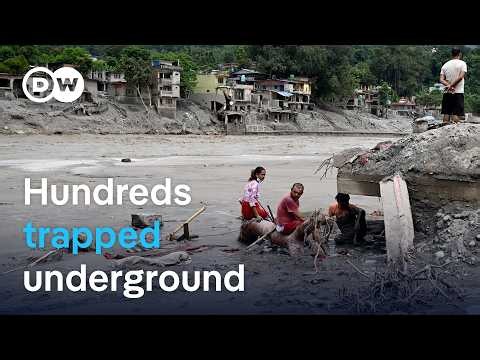Hundreds trapped underground after Nepal flood disaster | DW News