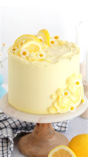 Whitney DePaoli | Sugar & Sparrow on Instagram: "LEMON LAYER CAKE 🍋✨pure sunshine in cake form: layers of extra soft and moist lemon cake + zesty lemon frosting + happy little chamomile flowers to make it extra cute 🥰 ⁣⁣ ⁣ Find the recipe on my blog at: sugarandsparrow.com/favorite-lemon-layer-cake⁣⁣⁣⁣⁣ ⁣⁣⁣⁣ #lemon #lemon #layercake #baking #yellowcake #cakesofinstagram #cakes #bake #cakedecorating #buttercreamcake ⁣"