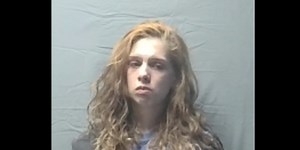 Woman arrested after child found in street