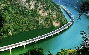 Over-Water Highway runs along the middle of a river valley in China