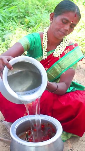Traditional Cooking of Rice and Vegetable Dish Outdoors
