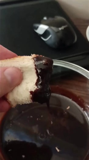 Chocolate bread is one of those humble, make-do treats that turns “almost stale” into something special. When you have a loaf that’s just past its prime, this is the perfect way to give it new life instead of tossing it out. It’s comfort food in the truest sense. Simple, warm, and made from what you already have on hand. To make the chocolate sauce, combine a half-cup of sugar, one-eighth cup of cocoa powder, a quarter-cup of milk, one tablespoon of butter, and a teaspoon of vanilla extract in a