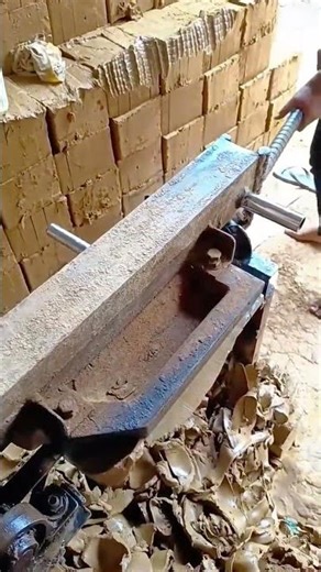 Machine planing wooden beam producing smooth precise construction surfaces