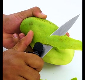 Satisfying Peeling A Green Mango
