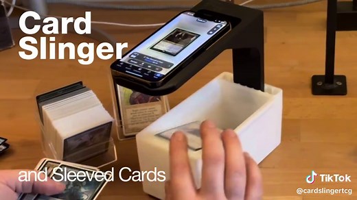 What is the Card Slinger? Update for Sept 2025 - New adjustable stand upgrade available! Fits all types of phones and works with all sorts of apps that fixed positions stands don't quite accommodate. This tool is designed to assist in scanning a large number of MTG, Pokemon, other TCG cards, sports cards and more, rapidly, by using the card scanning app of your choice on your phone. The card slinger is the first of its kind, patented device, don't accept imitations! The card slinger fits both sl